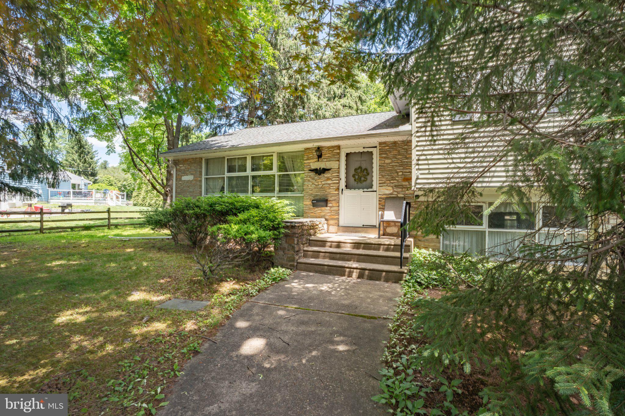 14 Lower Hilltop Road Yardley, PA 19067 - Photo 2 of 38 Charming home with lush greenery.