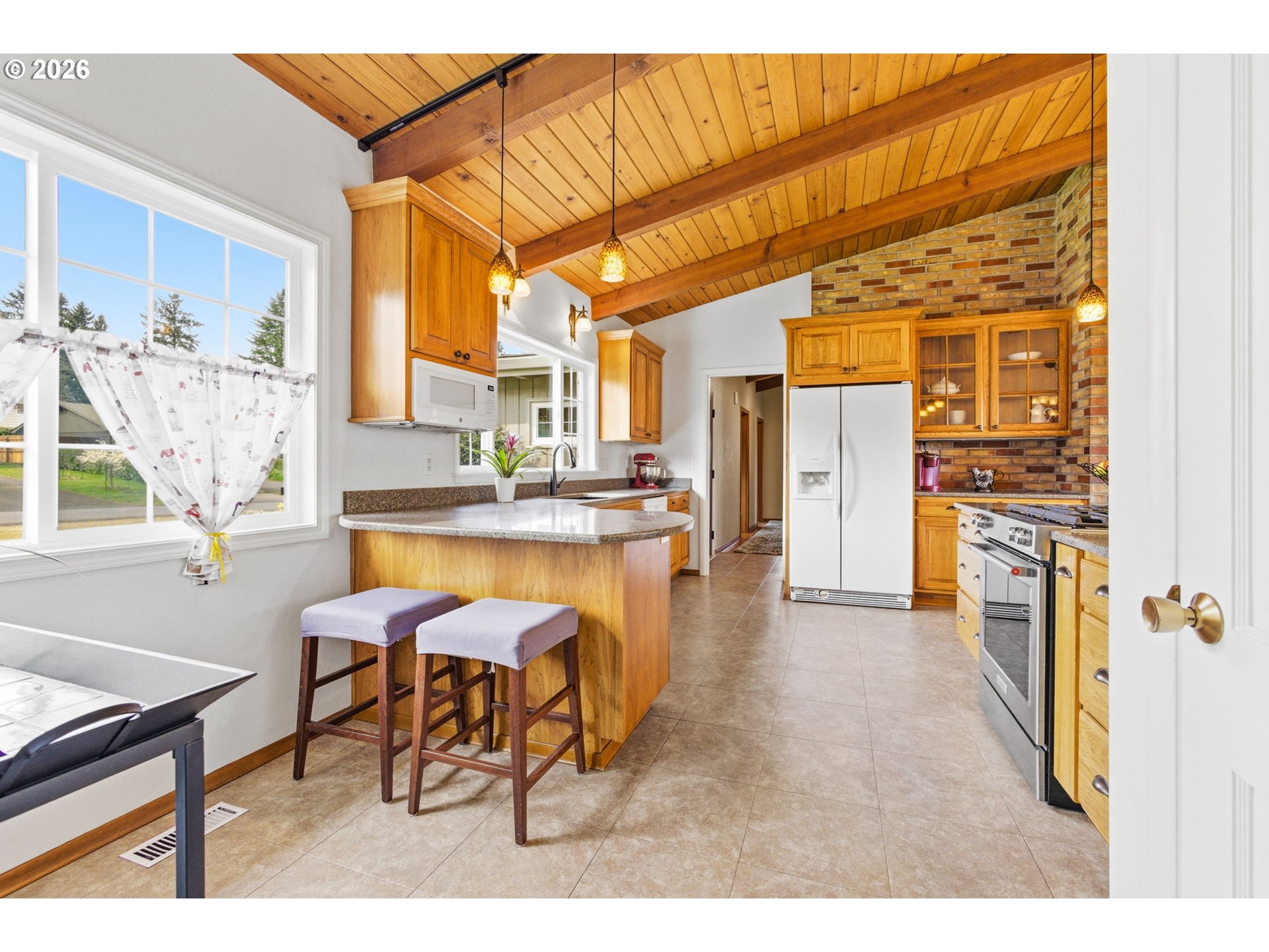 4064 Barrett Street South Salem, OR 97302 - Photo 11 of 48 a dining room with furniture and a kitchen view