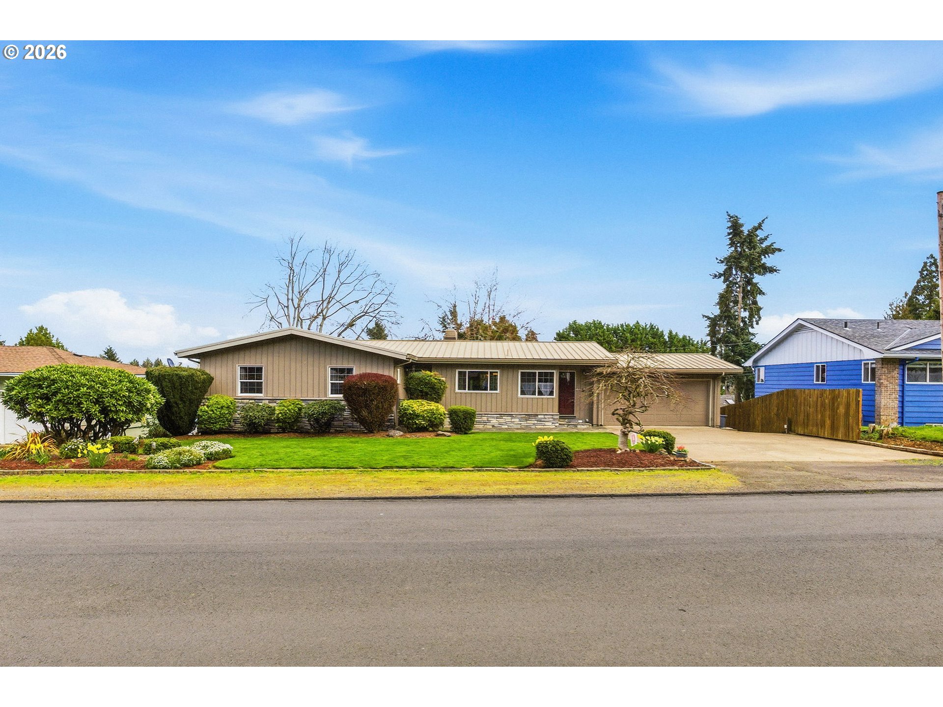 4064 Barrett Street South Salem, OR 97302 - Photo 2 of 48 a yellow house with trees in front of it