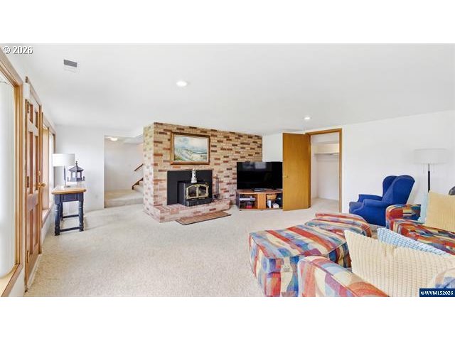 4064 Barrett Street South Salem, OR 97302 - Photo 25 of 48 a living room with furniture and a fireplace