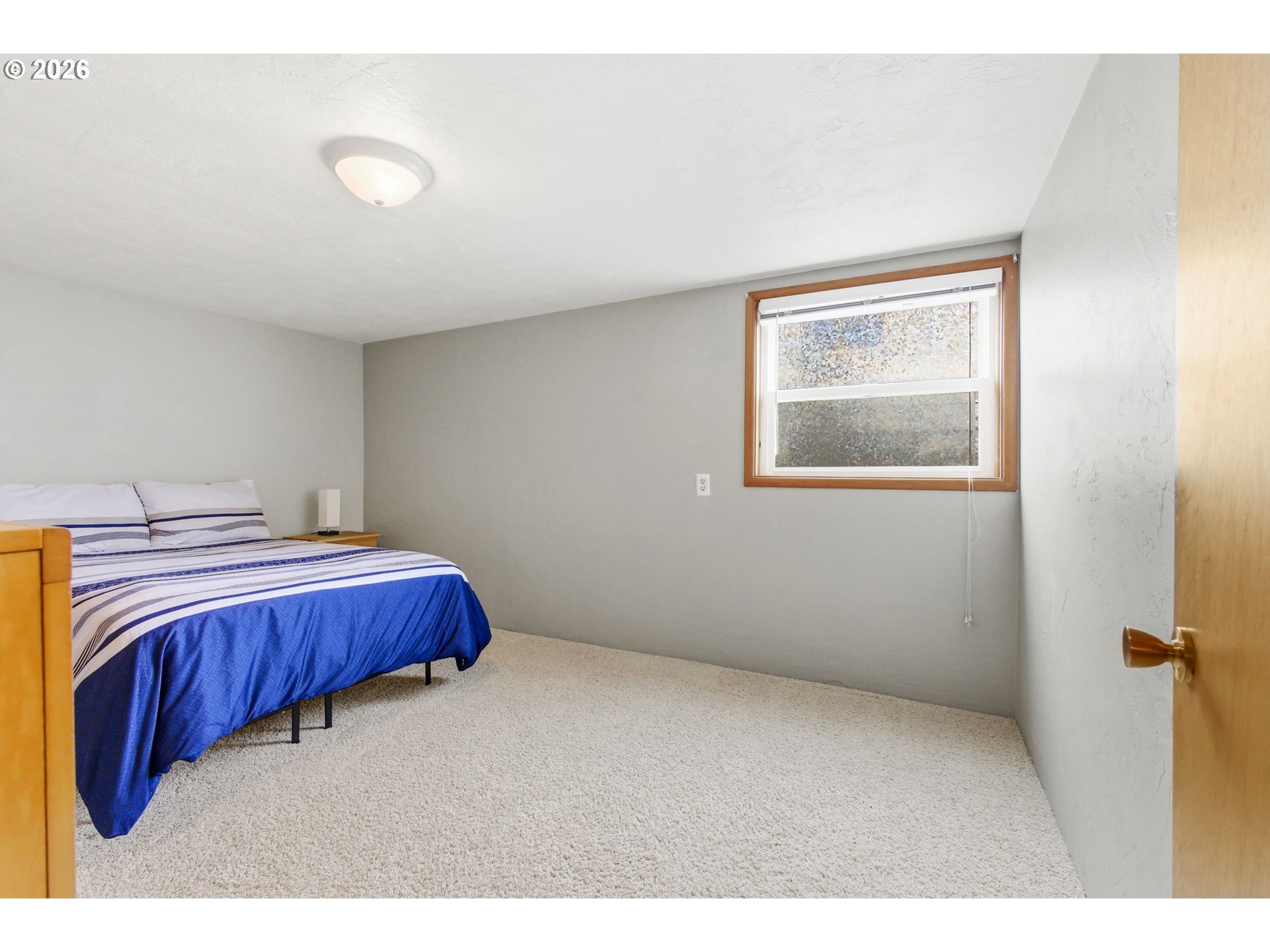 4064 Barrett Street South Salem, OR 97302 - Photo 36 of 48 a bedroom with a bed and a cabinets