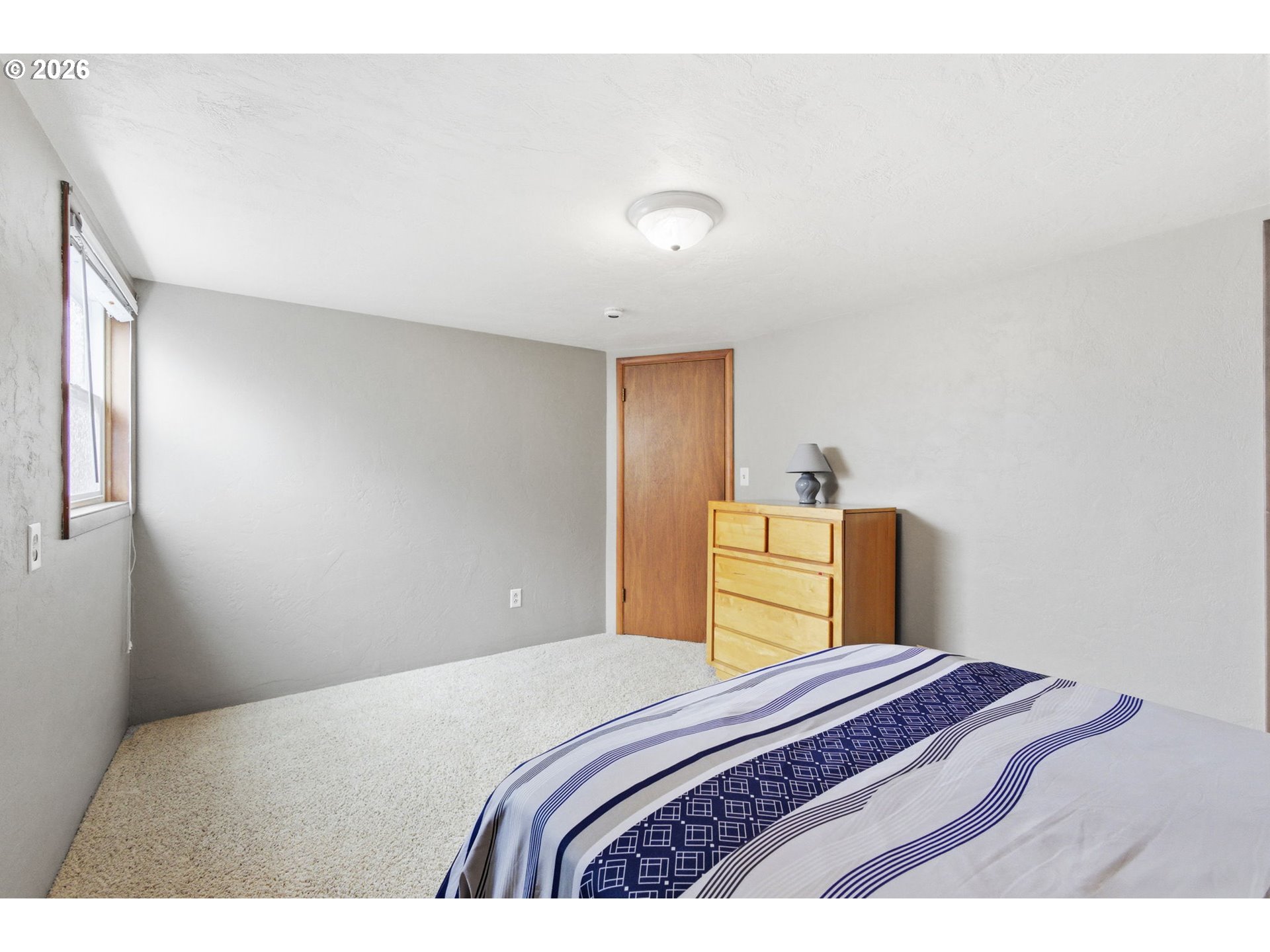 4064 Barrett Street South Salem, OR 97302 - Photo 38 of 48 a bedroom with a bed and wooden floor