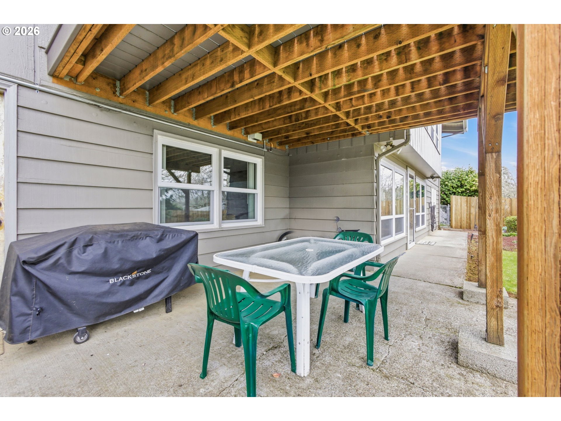 4064 Barrett Street South Salem, OR 97302 - Photo 39 of 48 a view of a patio with table and chairs with wooden floor and plants