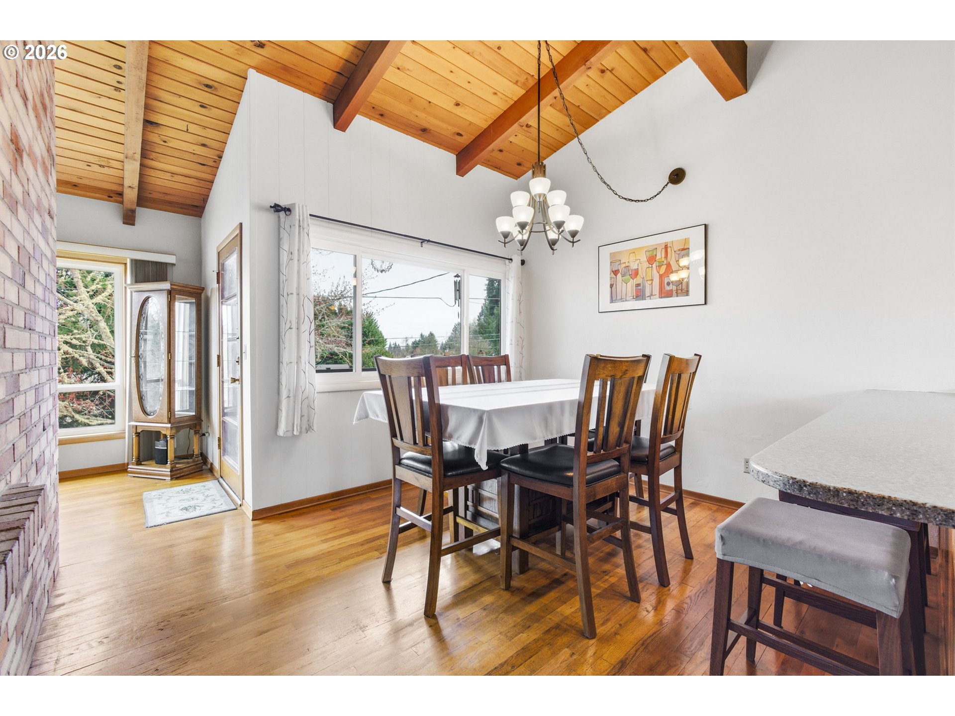 4064 Barrett Street South Salem, OR 97302 - Photo 7 of 48 a view of a dining room with furniture and wooden floor