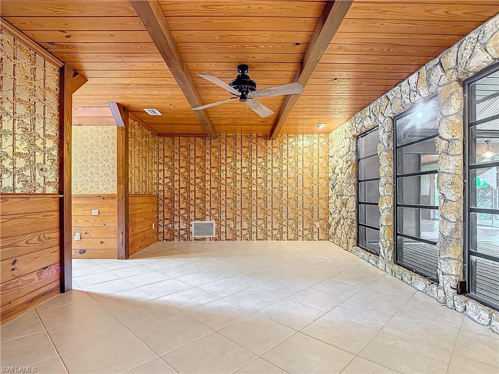 3550 11th Avenue Southwest Naples, FL 34117 - Photo 18 of 35 Parlor room featuring beam ceiling, ceiling fan, and wooden ceiling