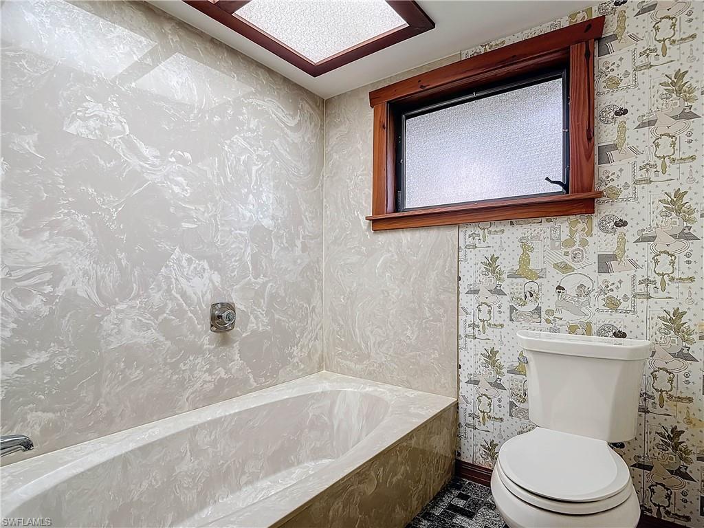 3550 11th Avenue Southwest Naples, FL 34117 - Photo 25 of 35 Guest Bathroom with toilet and a bathing tub