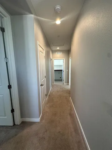 an entryway of a room with a fireplace