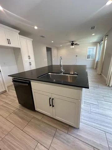 a kitchen with a sink and cabinets