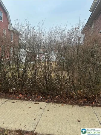 a view of a yard covered in snow