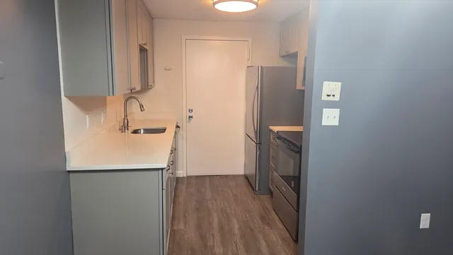 a bathroom with a sink and mirror