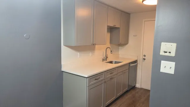 a kitchen with a stove microwave and refrigerator