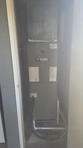 a view of water heater and white door