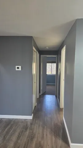 a bathroom with a tub sink and shower