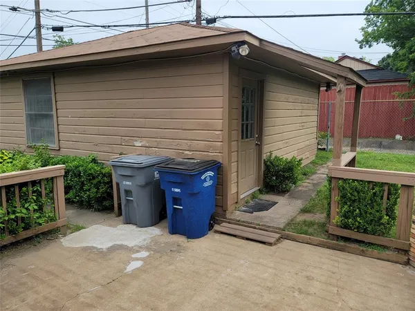 a view of a patio with a yard