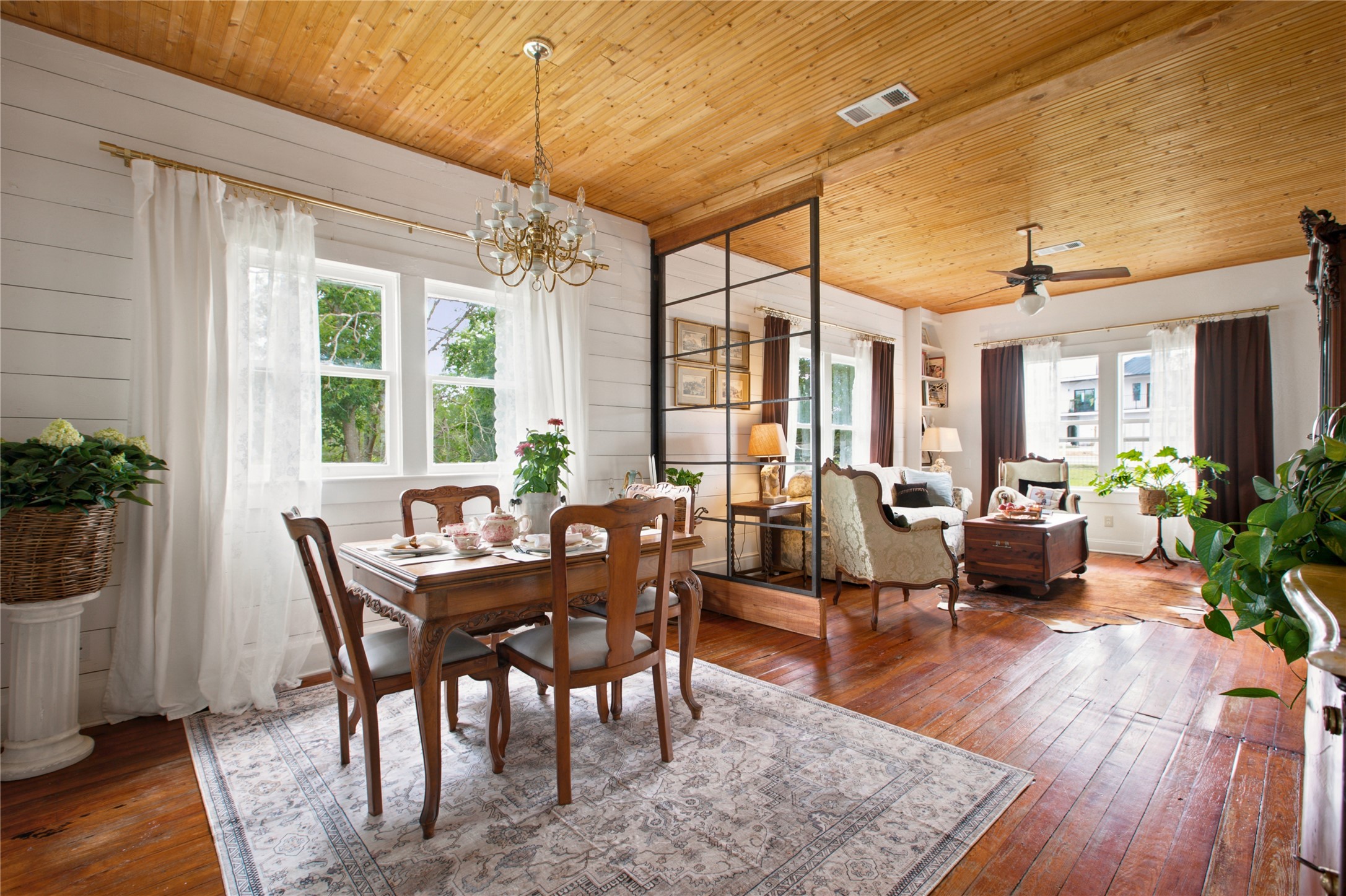 372 Old Lockhart Road Lockhart, TX 78644 - Photo 2 of 40 Hardwood floors and beadboard ceilings enhance the character of this inviting dining and living area.