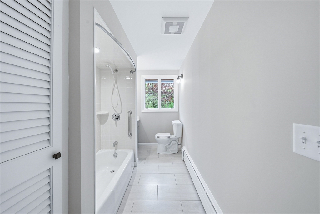 1 Ayrshire Road Worcester, MA 01604 - Photo 14 of 41 a bathroom with a granite countertop sink a toilet and a shower