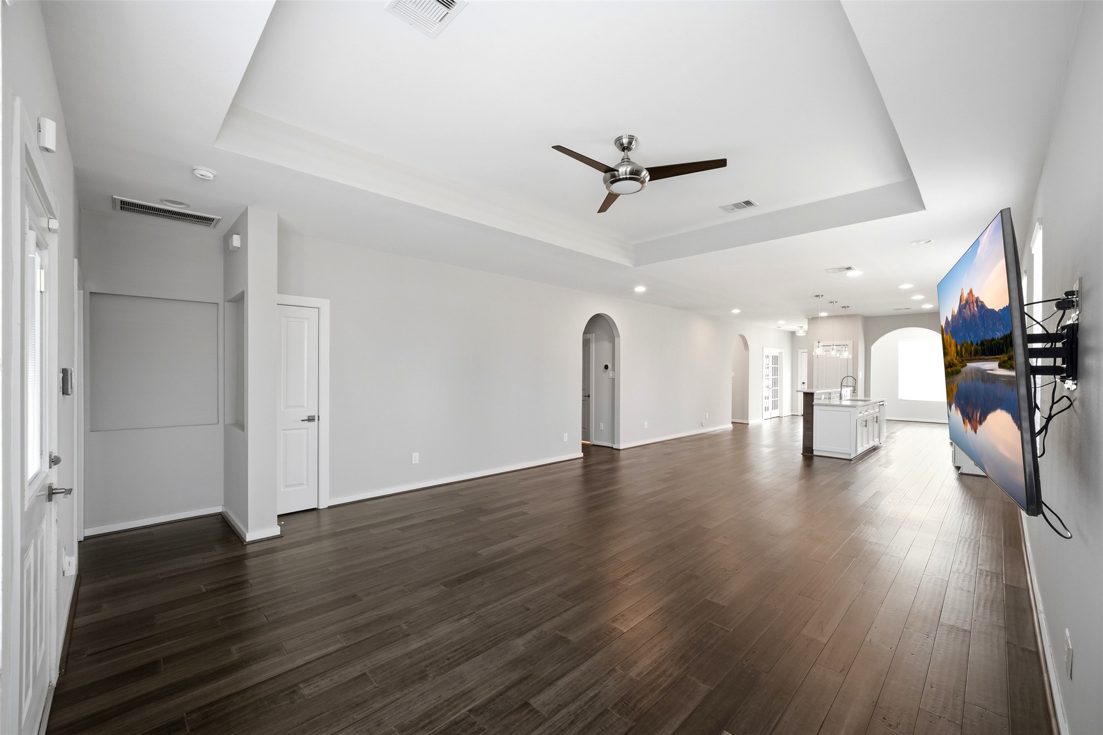 605 Dumble Street Houston, TX 77023 - Photo 13 of 44 a view of empty room with wooden floor