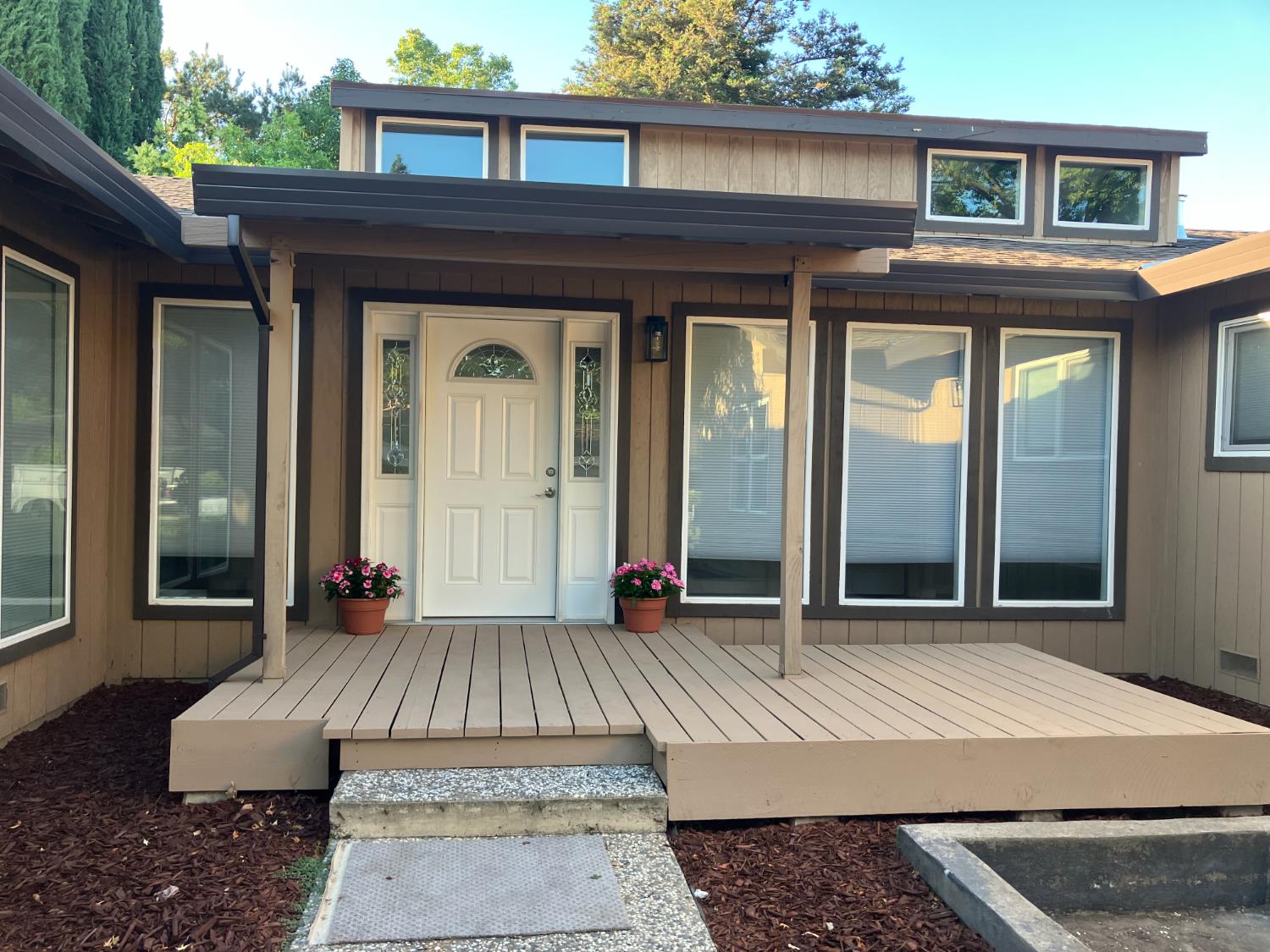 a view of a house with a door and wooden floor