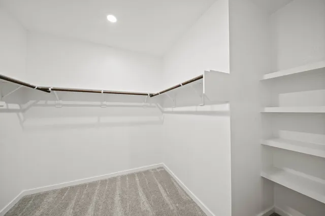 a view of an empty walk in closet
