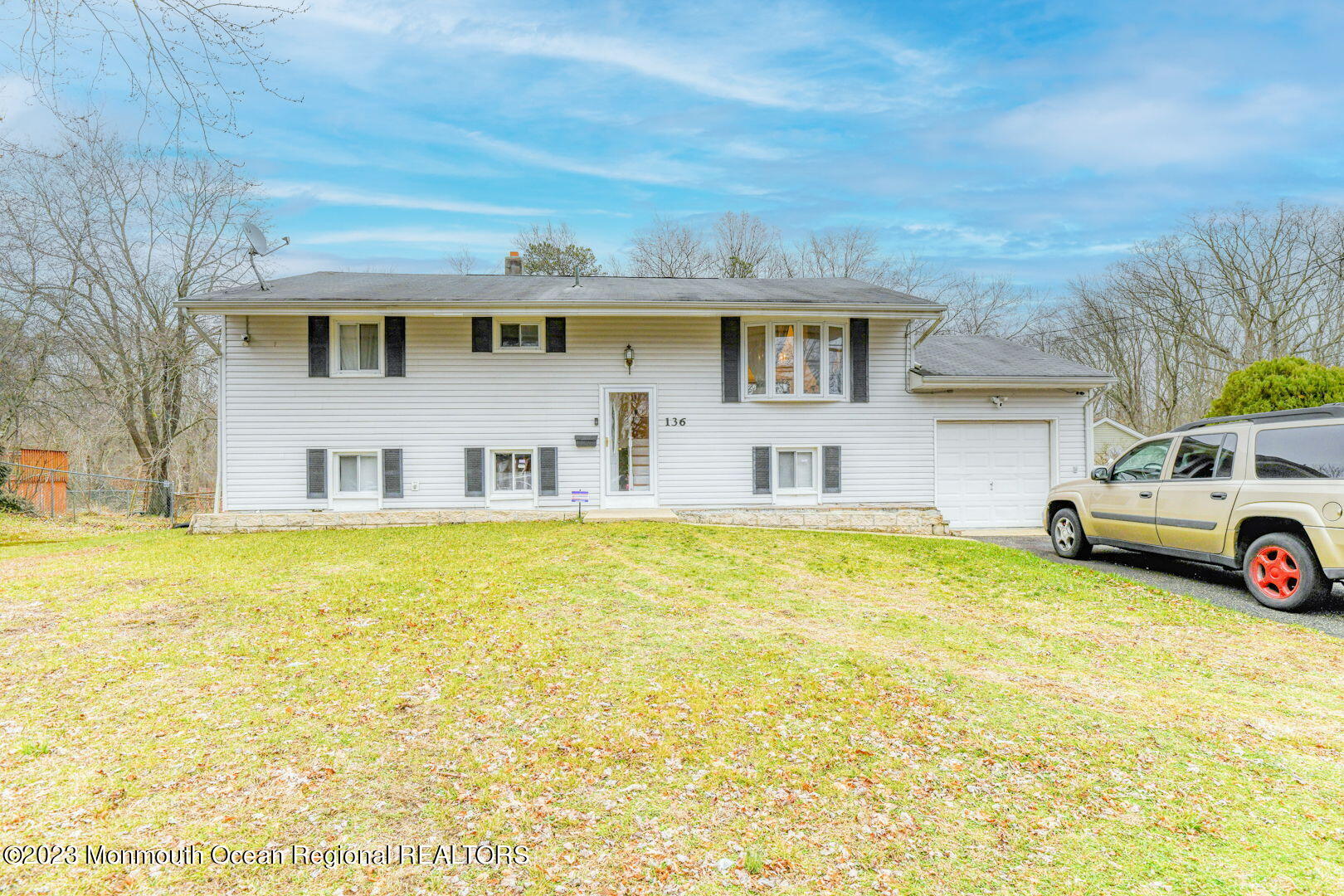 136 Newbury Road Howell, NJ 07731 - Photo 1 of 33 a front view of a house with cars parked