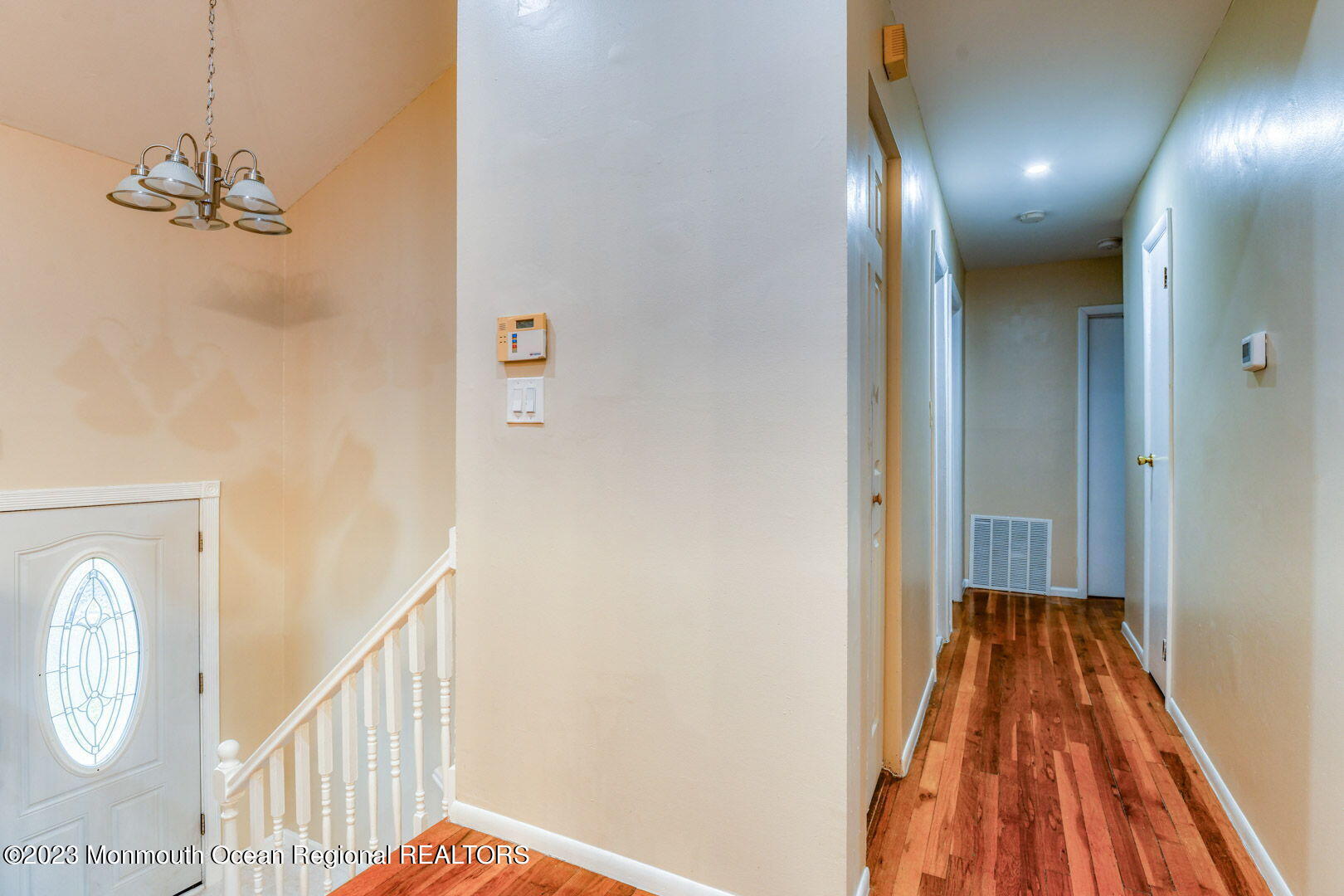 136 Newbury Road Howell, NJ 07731 - Photo 25 of 33 a view of a hallway with wooden floor and staircase