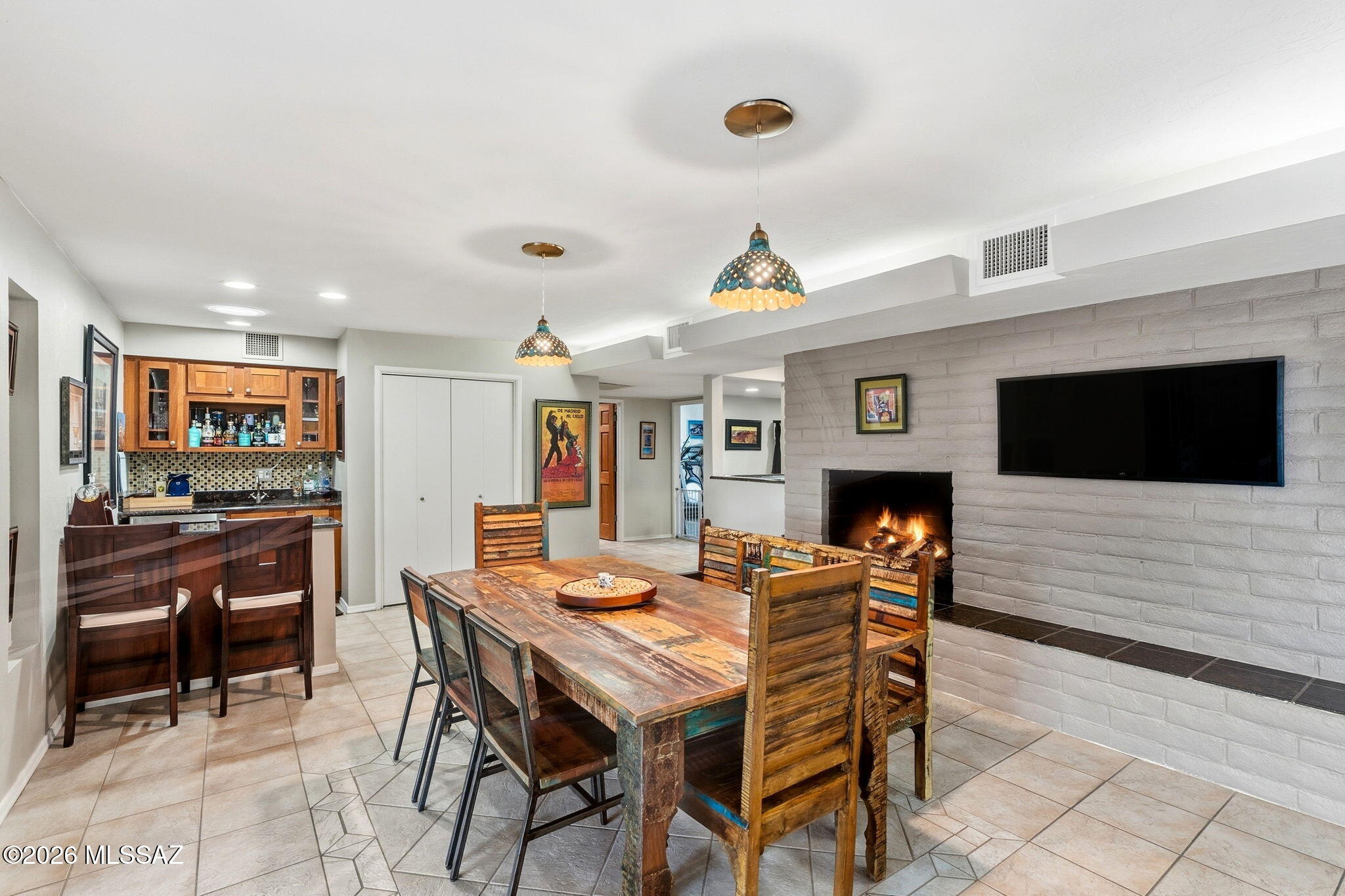 4641 North Rockcliff Road Tucson, AZ 85750 - Photo 20 of 48 Dining Area, with fireplace and Spirits station
