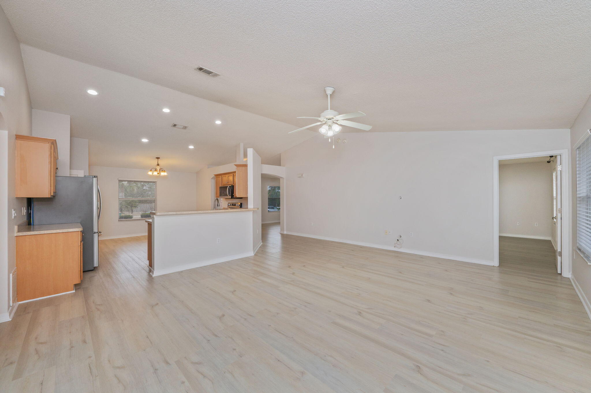 2405 Cumberland Way Crestview, FL 32536 - Photo 13 of 47 a view of a kitchen with furniture and wooden floor