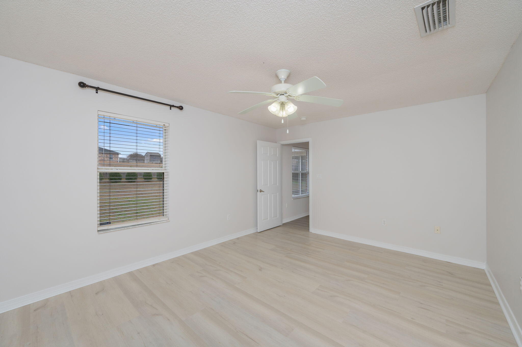 2405 Cumberland Way Crestview, FL 32536 - Photo 21 of 47 a view of an empty room with a window