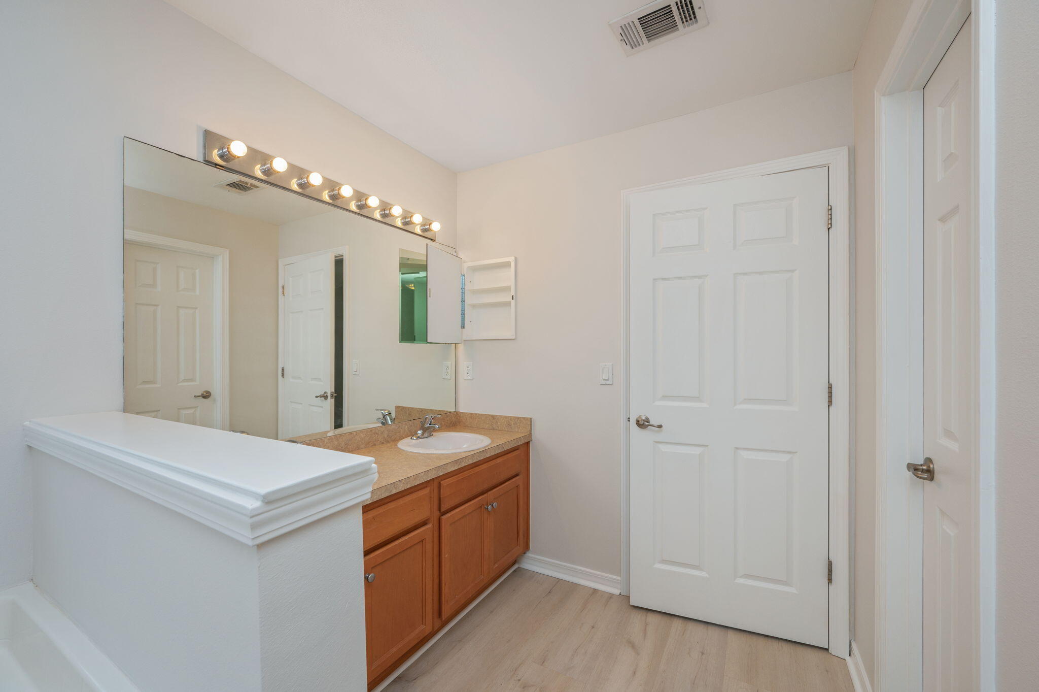 2405 Cumberland Way Crestview, FL 32536 - Photo 24 of 47 a bathroom with a double vanity sink and a mirror