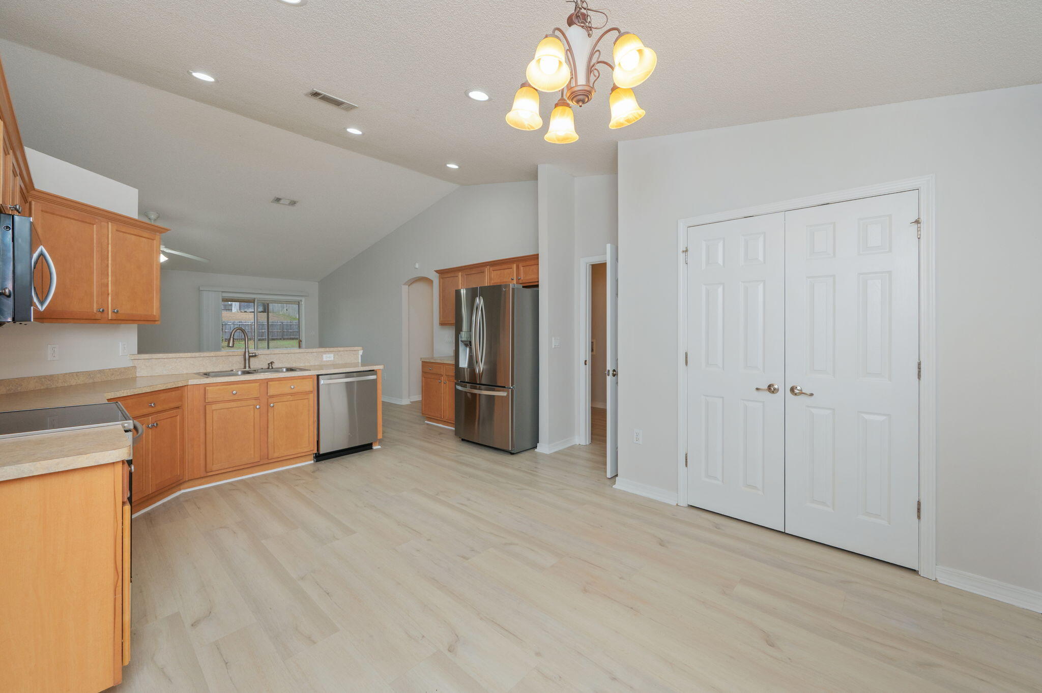 2405 Cumberland Way Crestview, FL 32536 - Photo 29 of 47 a large white kitchen with a sink stainless steel appliances and cabinets