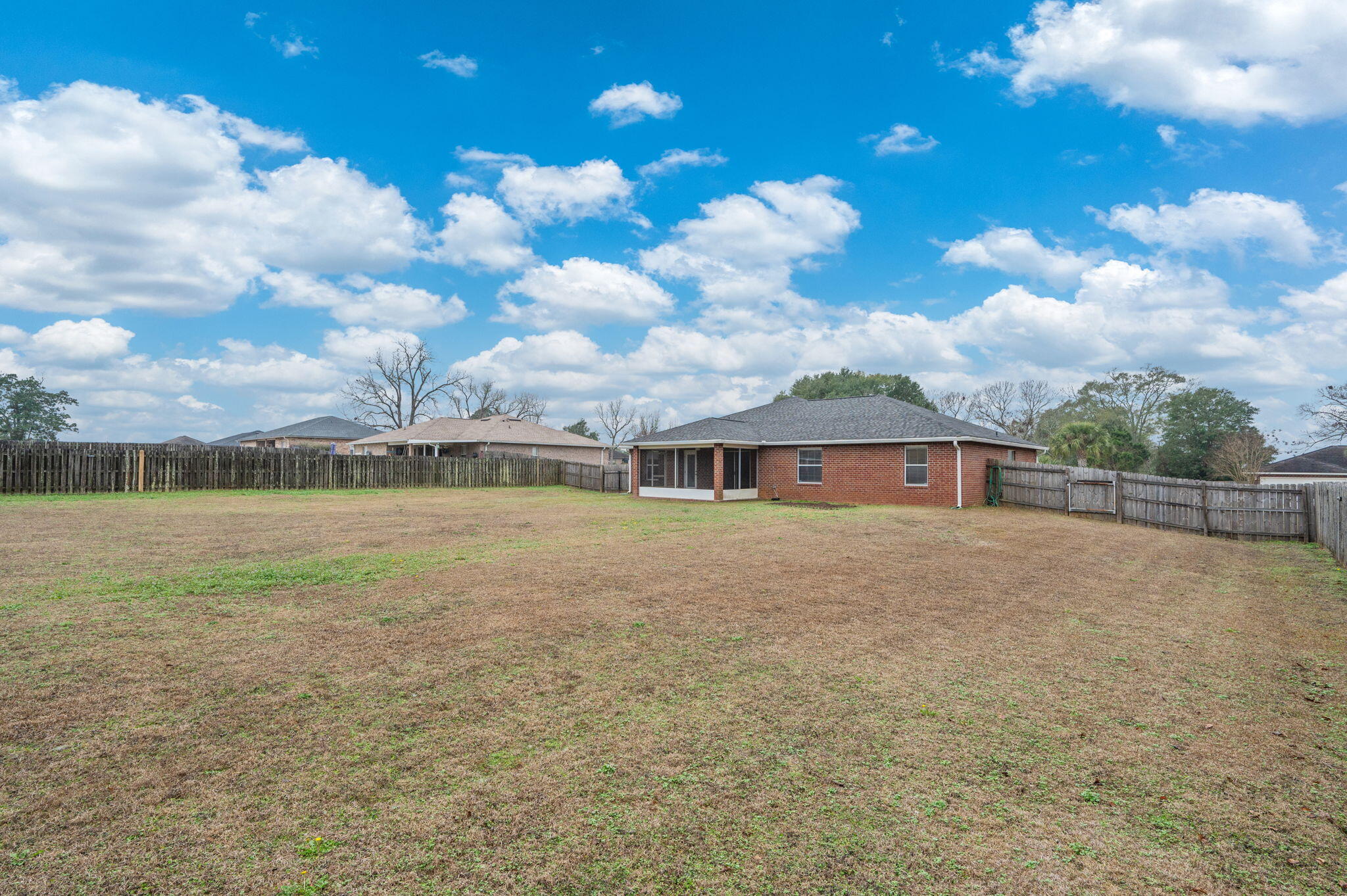2405 Cumberland Way Crestview, FL 32536 - Photo 44 of 47 a view of a house with a yard