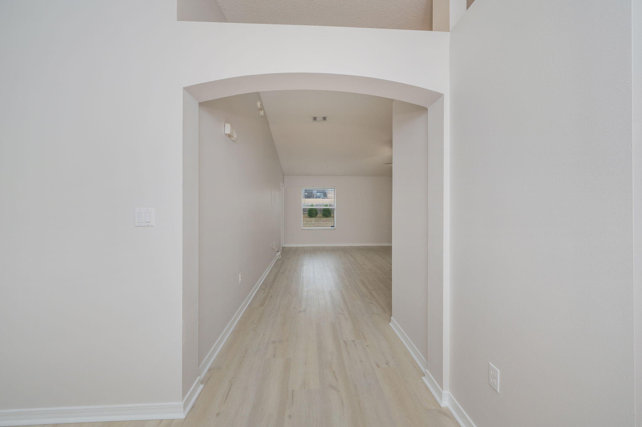 2405 Cumberland Way Crestview, FL 32536 - Photo 7 of 47 a view of a hallway view with wooden floor and staircase
