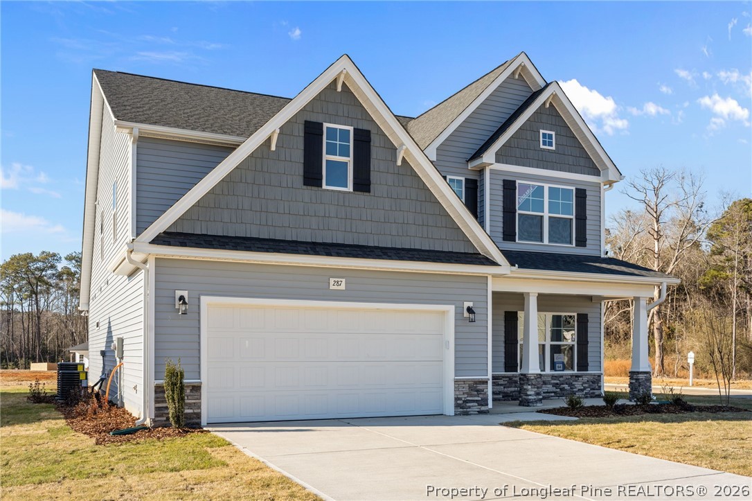 287 Elijah Way Vass, NC 28394 - Photo 1 of 49 a front view of a house with a yard