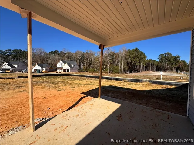 a view of swimming pool with a lawn chairs