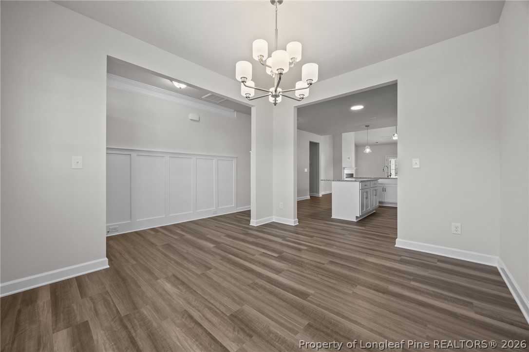 287 Elijah Way Vass, NC 28394 - Photo 15 of 49 a view of a livingroom with a chandelier