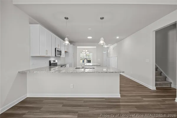 a bathroom with a toilet a sink and a mirror