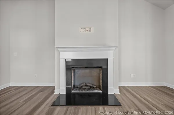 a view of an empty room with a ceiling fan