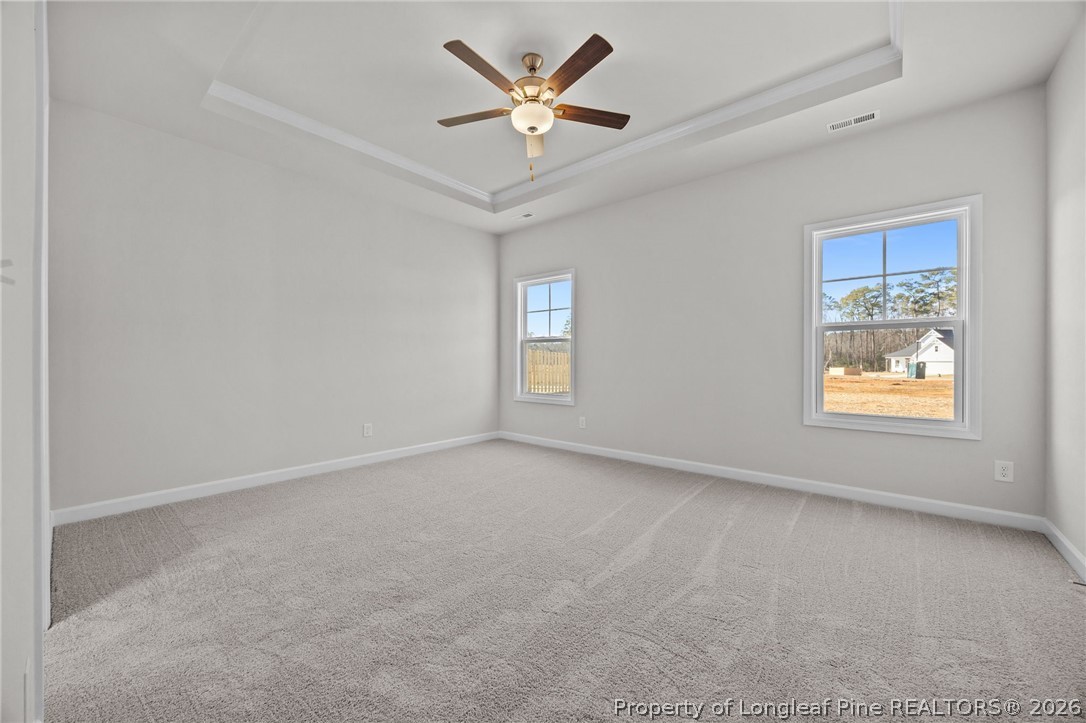 287 Elijah Way Vass, NC 28394 - Photo 27 of 49 an empty room with windows and fan