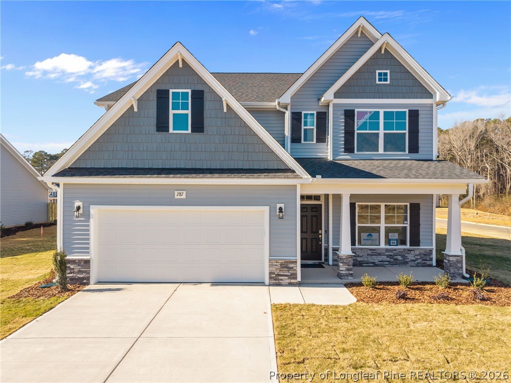287 Elijah Way Vass, NC 28394 - Photo 3 of 49 a front view of a house with a yard