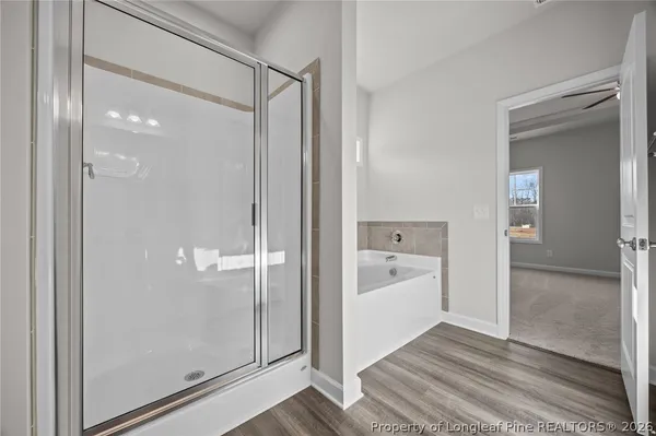 a bathroom with a sink a toilet and a large mirror