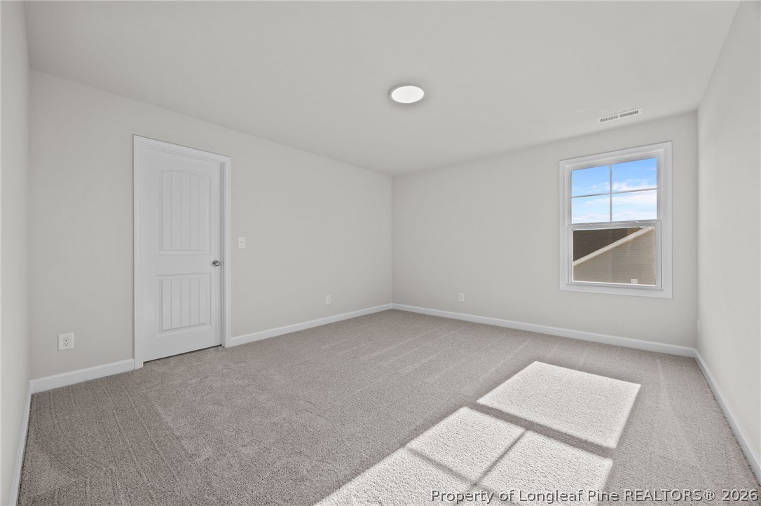 287 Elijah Way Vass, NC 28394 - Photo 39 of 49 an empty room with windows