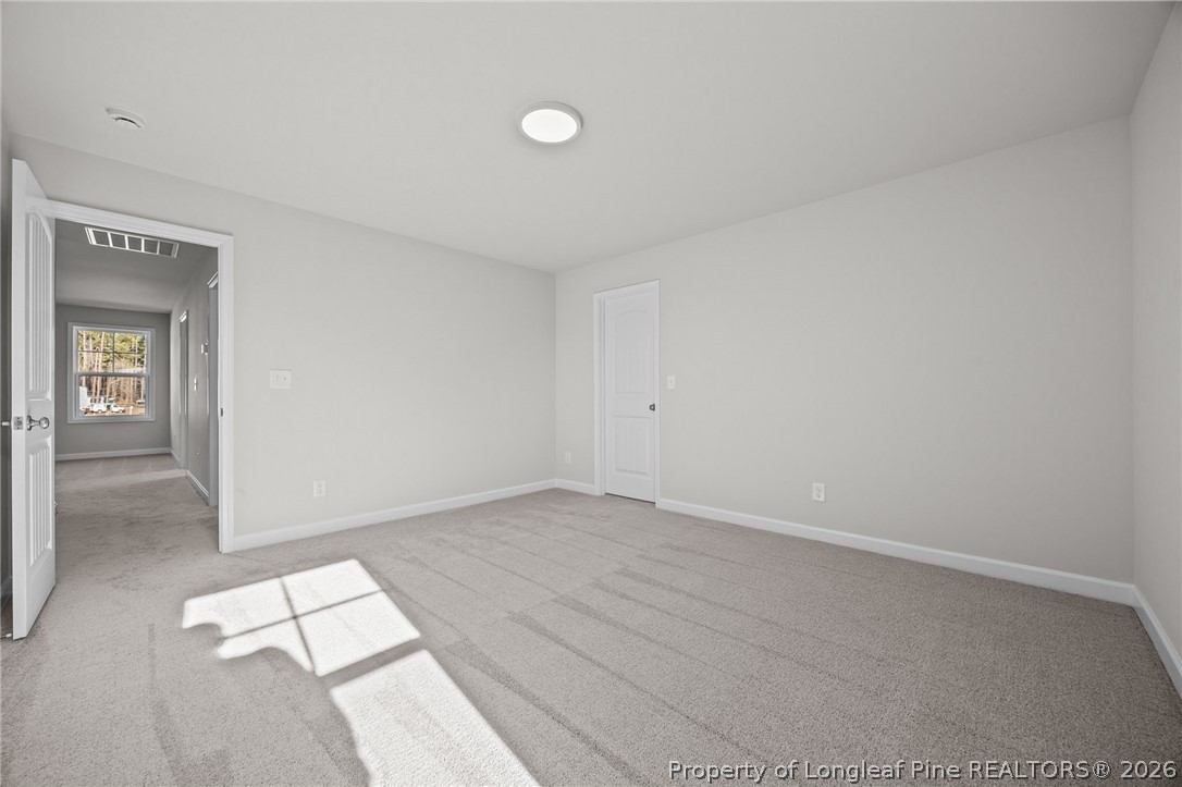 287 Elijah Way Vass, NC 28394 - Photo 40 of 49 a view of an empty room and window