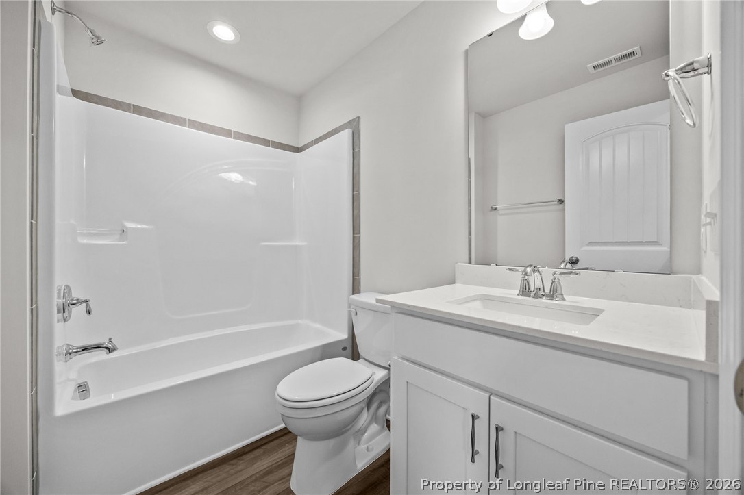 287 Elijah Way Vass, NC 28394 - Photo 42 of 49 a bathroom with a sink a toilet and shower