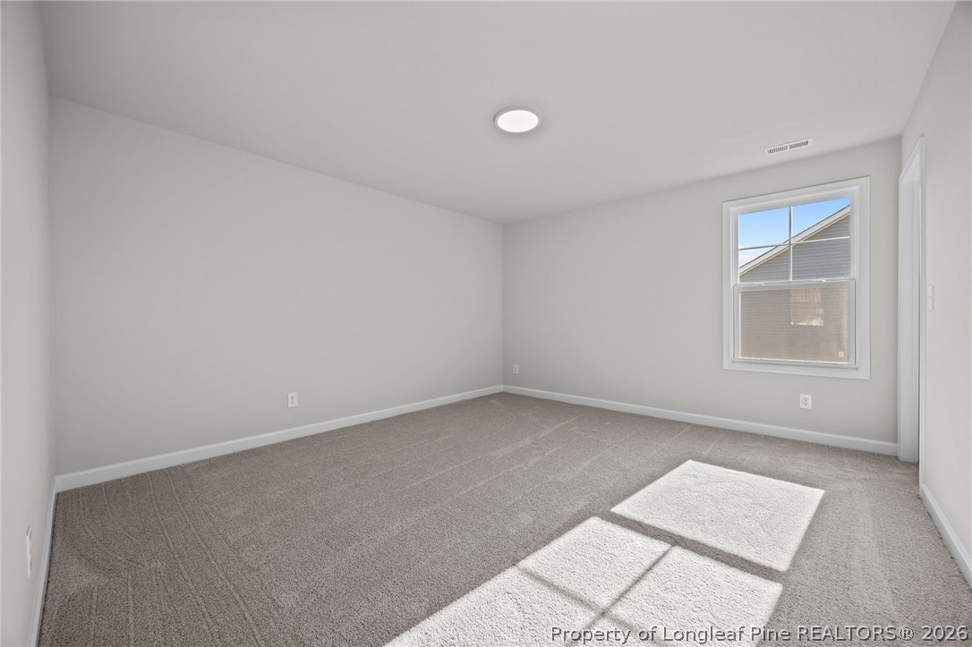 287 Elijah Way Vass, NC 28394 - Photo 43 of 49 an empty room with windows
