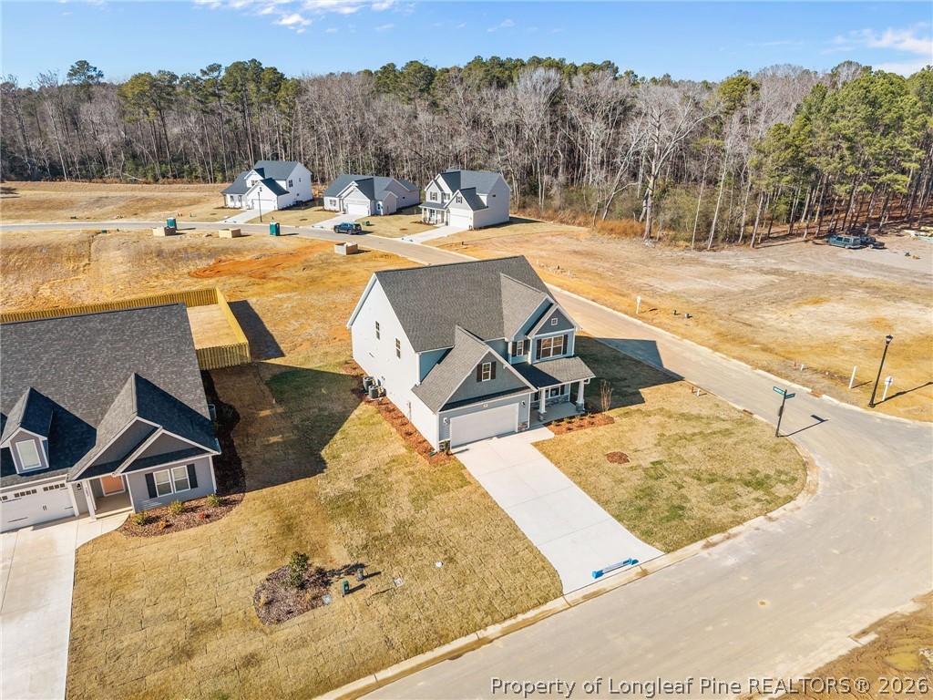 287 Elijah Way Vass, NC 28394 - Photo 5 of 49 a view of a swimming pool with a patio