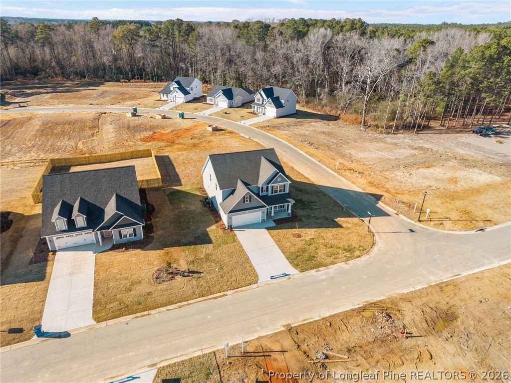 287 Elijah Way Vass, NC 28394 - Photo 9 of 49 a view of a swimming pool with a patio