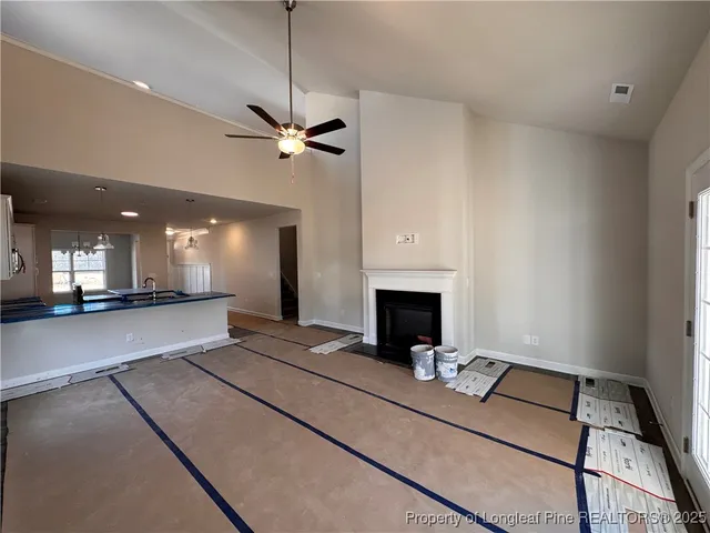 a view of an empty room with a fireplace