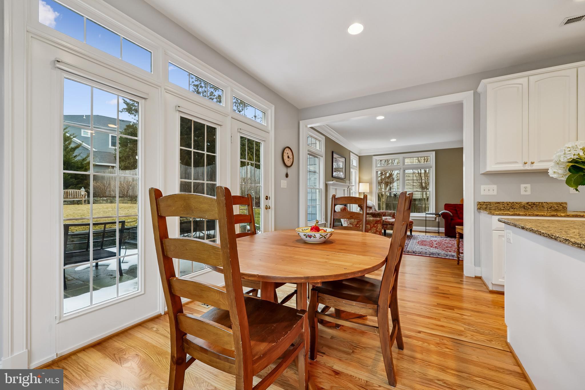 8807 Ridge Road Bethesda, MD 20817 - Photo 13 of 72 a view of a dining room with furniture and wooden floor
