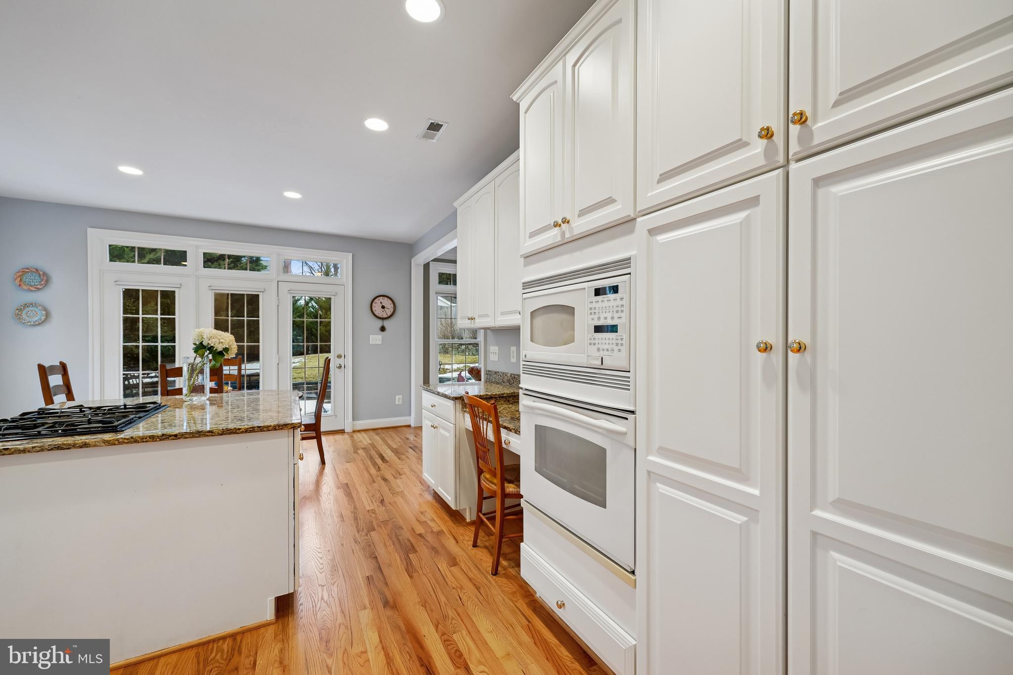 8807 Ridge Road Bethesda, MD 20817 - Photo 17 of 72 a kitchen with stainless steel appliances a refrigerator and a stove top oven