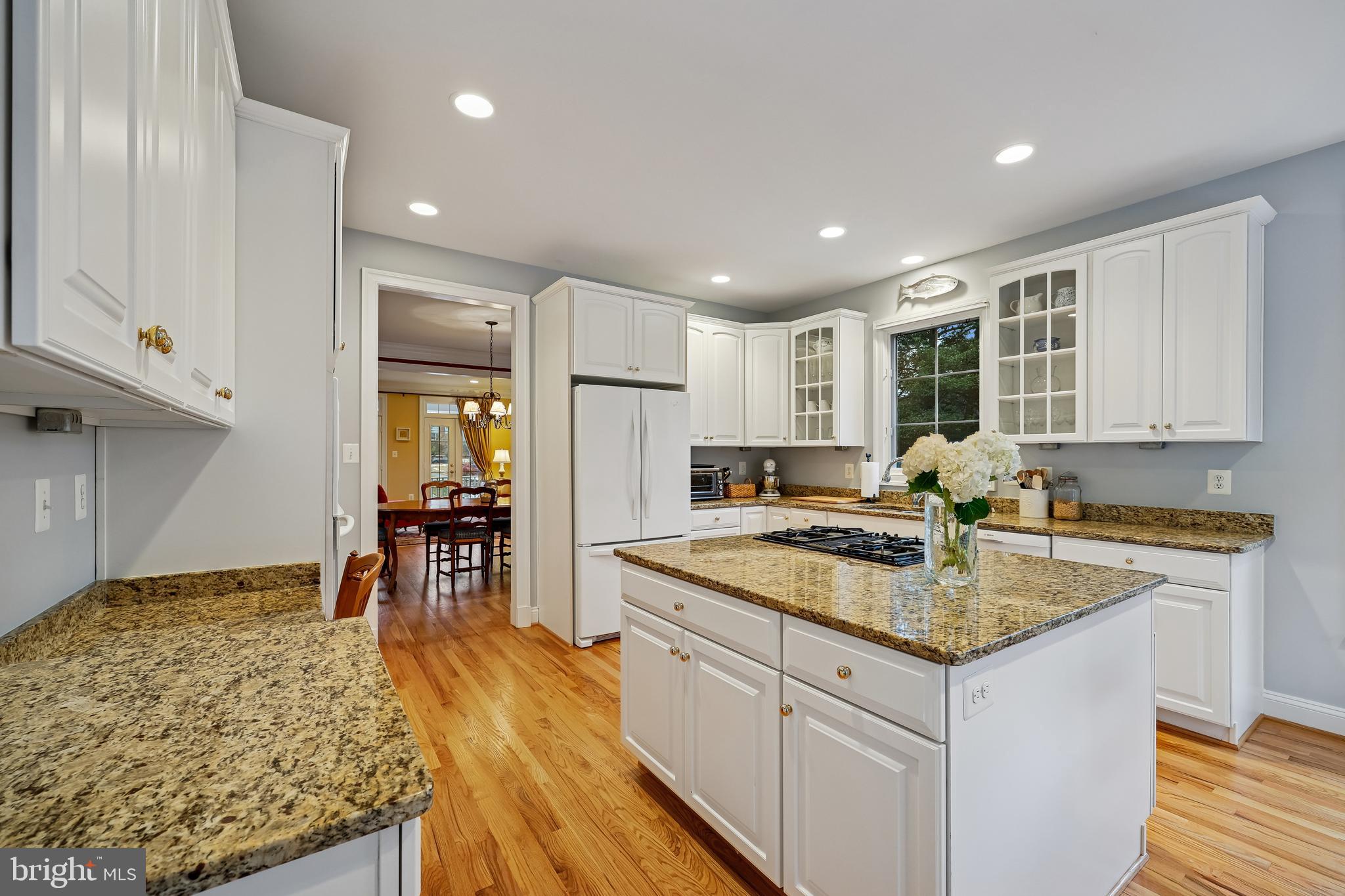 8807 Ridge Road Bethesda, MD 20817 - Photo 25 of 72 a kitchen with stainless steel appliances granite countertop sink stove refrigerator and cabinets